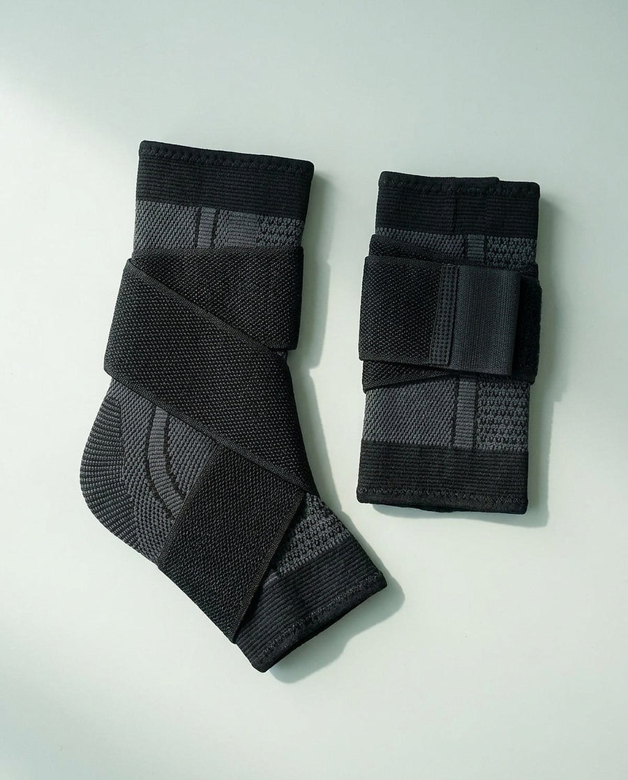 Two sleeves laid flat, one open with the strap extended and one folded.