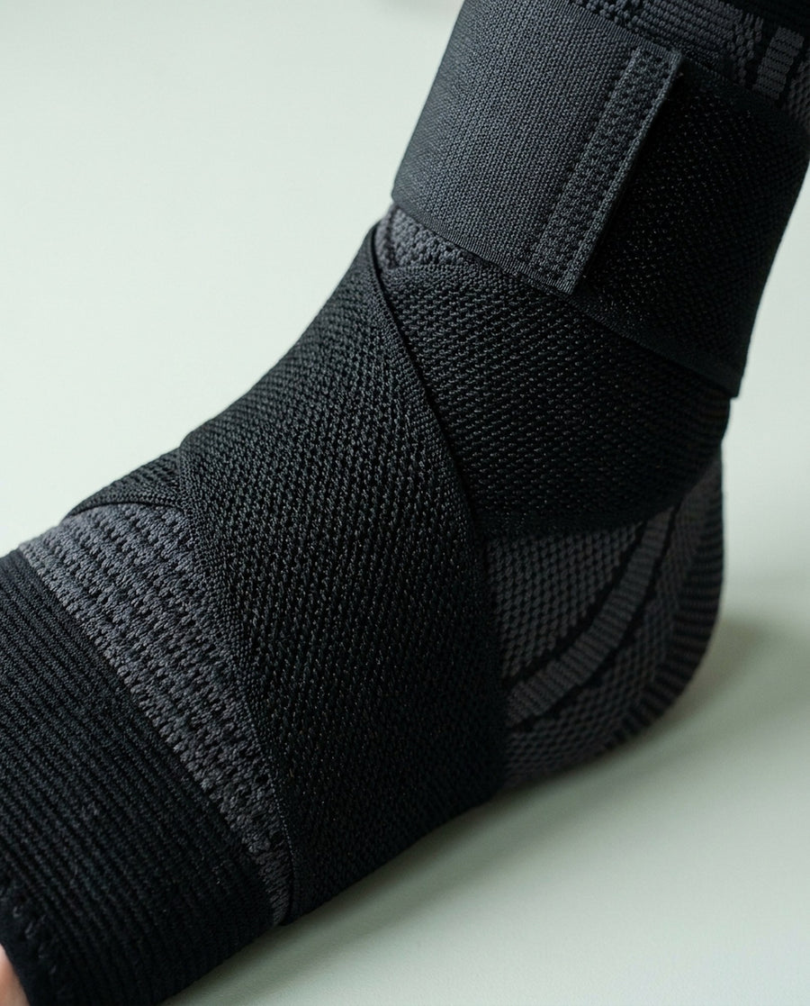 Close-up of the elastic strap under tension where it crosses the midfoot.